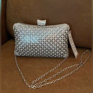 NWT. Very chic sliver clutch